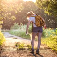 Someone Standing on a Path Spraying against Mosquitoes